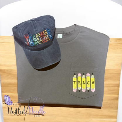 Women's Pencil "TEACH" Pocket Tee