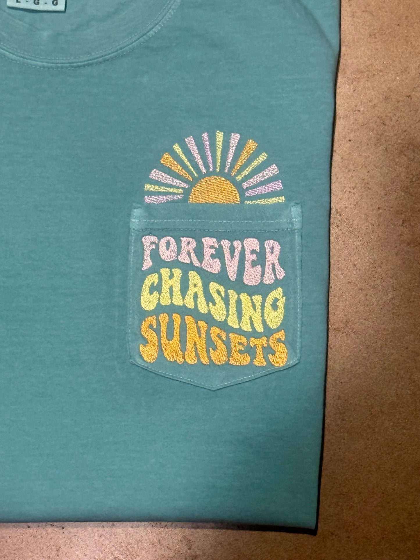 Women's "Forever Chasing Sunsets" Pocket Tee